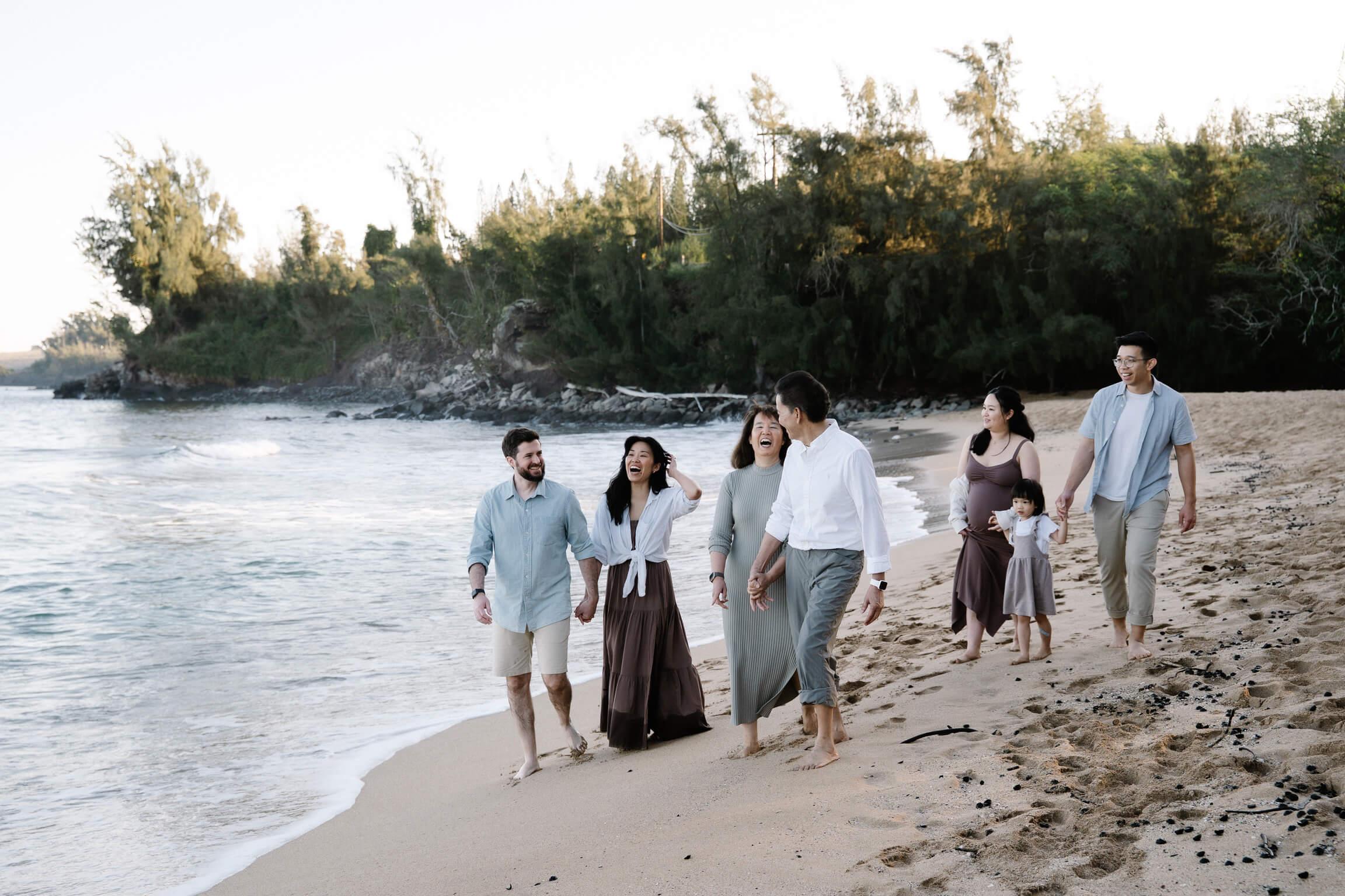 Rick walks with his family on the beach in Maui.
